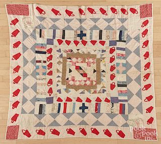 Pieced and appliqué youth quilt, early 20th c., 58'' x 56''.
