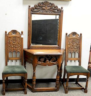 Four piece oak lot to include table, two chairs, server, and mirror. server: ht. 31in.; wd. 34in.