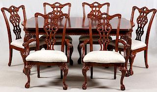 CHIPPENDALE STYLE CARVED MAHOGANY TABLE AND CHAIRS