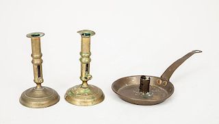Two Brass Candlesticks and a Brass Chamber Candlestick