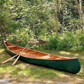 Arthur E. Levenseller 20-foot Canoe with Two Canoe Paddles.