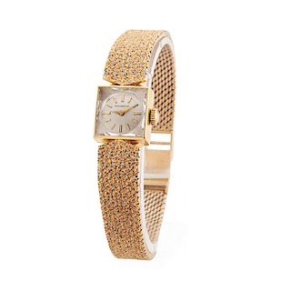 LADY'S TRI-COLORED GOLD MOVADO ESZEHA WATCH