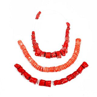 Three Strands of Coral Beads.