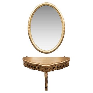 COQUETA SIGLO XX Elaborada en madera policromada en tono dorado Consola empotrable Espejo con luna oval biselada, marco con...