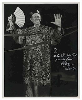 Okito (Tobias Bamberg). Portrait of Okito, inscribed and signed. Classic full-length portrait of an older Okito in Chinese robe, a fan in one hand, ri