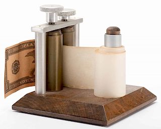 Money Maker. North Hollywood: Merv Taylor, ca. 1950. Blank paper rolled through this device turns into real currency. Wooden base with metal rollers a