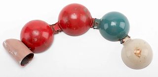 Multiplying Billiard Balls. English, ca. 1950s. Precision-made metal billiard balls in red, white, and blue, hinged together with attached thumb tip. 