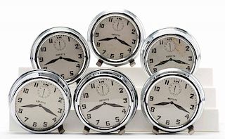 Nest of Alarm Clocks. Colon: Abbott's Magic Novelty Co., ca. 1940s. Set of six nesting metal clocks, with hallmarked dials, to be produced from a hat 