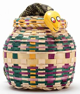 Simplified Snake Basket. Colon: Abbott's Magic, ca. 1965. A faux snake is thrown in a woven basket along with a pack of cards. After comedic by-play, 
