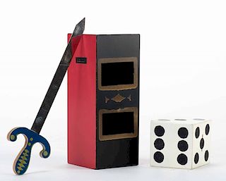 Sword and Die. Japan, ca. 1970. Painted wooden oblong box with sword and die for the penetration effect. Boxed with instructions, as-new.