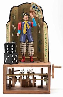 Clown with Vanishing Head Automaton. Paris, Pierre Mayer, ca. 2006. Handmade wooden automaton with exposed works. A clown holds a fan in front of his 
