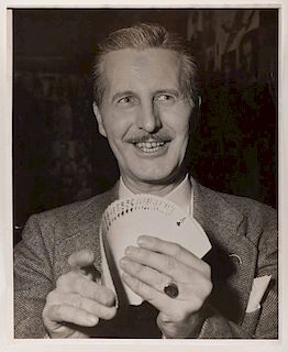 Vernon, Dai. Portrait of Dai Vernon Fanning Cards. Circa 1948. Oversize half-length portrait of ÒThe ProfessorÓ in a tweed coat performing a pressur
