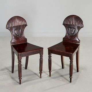 Pair George V carved mahogany hall chairs