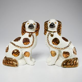 Pair Staffordshire copper lustre pottery spaniels