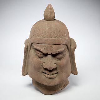 Early Asian carved stone Guardian head fragment