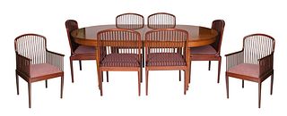 A MID-CENTURY MODERN WOOD DINING TABLE ACCOMPANIED WITH EIGHT CHAIRS