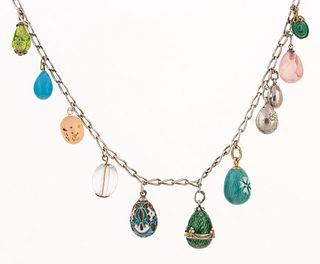 AN ANTIQUE RUSSIAN GOLD, SILVER, ENAMEL AND HARDSTONE MINIATURE EGG NECKLACE, VARIOUS MAKERS, 1899-1908