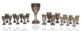 A SET OF SILVER AND SILVER-PLATED CUPS