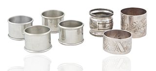 A GROUP OF SEVEN CONTEMPORARY AND VINTAGE SILVER NAPKIN RINGS