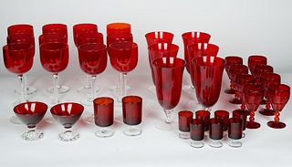A GROUP OF THIRTY-SEVEN VINTAGE HAND-BLOWN ARTISANAL CRANBERRY RED GLASS STEMWARE