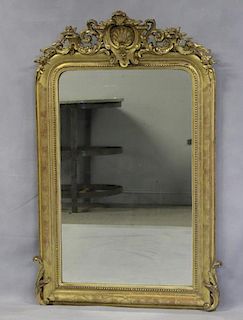 Antique Giltwood Mirror with Shell Crown.