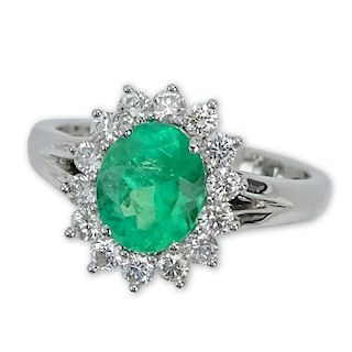 1.63 Carat Oval Cut Emerald, .65 Carat Round Brilliant Cut Diamond and 18 Karat White Gold Ring