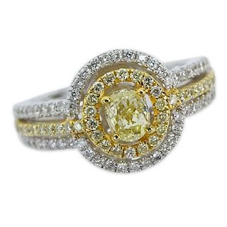 Approx. .80 Carat Fancy Yellow Diamond, .30 Carat Round Cut Diamond and 18 Karat White Gold Ring