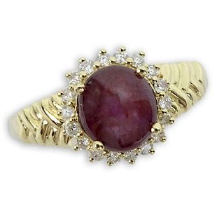 2.73 Carat Star Ruby and 14 Karat Yellow Gold Ring accented with Round Cut Diamonds