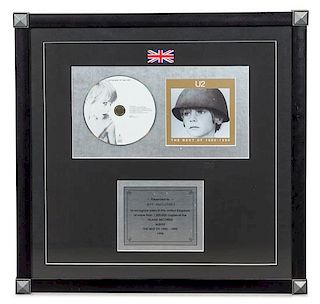 A U2: The Best of 1980-1990 1.2 Million UK Copies Sold Presentation Album 18 3/4 x 18 3/4 inches.