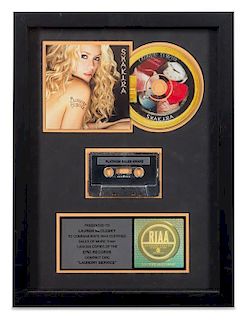 A Shakira: Laundry Service RIAA Certified Platinum Presentation Album 16 1/4 x 12 1/4 inches.