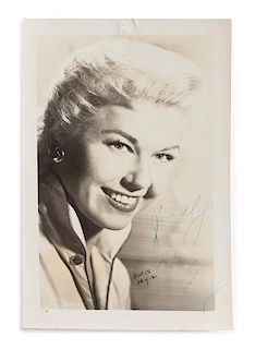 A Doris Day Autographed Lobby Card 5 x 3 1/4 inches.