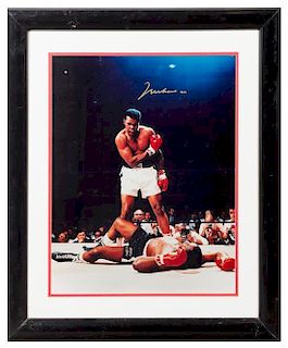 A Muhammad Ali Autographed Photo 19 x 15 inches visible.