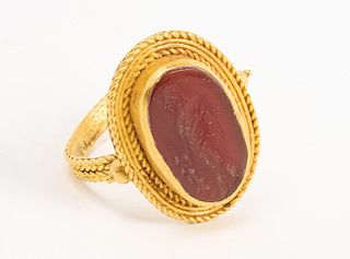 Early Gold Ring with Carved Figure