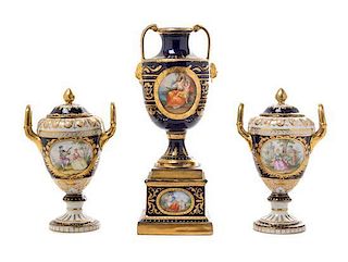 * Three Royal Vienna Porcelain Twin-Handled Urns Height of tallest 9 inches.