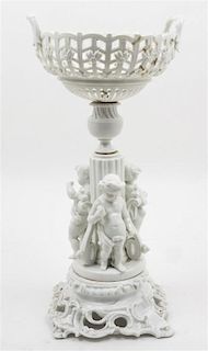 * A Continental Porcelain Figural Centerpiece Height 18 inches.