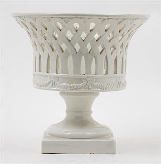 * A White Glazed Ceramic Basket Height 8 1/2 inches.