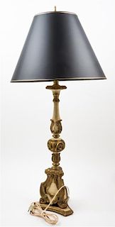 An Italian Painted and Parcel Gilt Pricket Stick Height overall 39 inches.