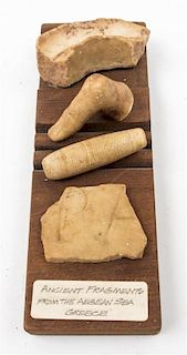 * Four Mounted Roman Antiquity Fragments Length of panel 10 x width 3 1/2 inches.