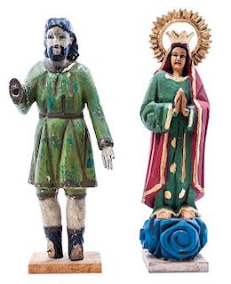 Two Carved and Polychrome Decorated Santos Figures Height of taller 13 1/2 inches.