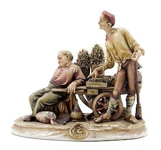An Italian Porcelain Figural Group Height 10 1/2 inches.