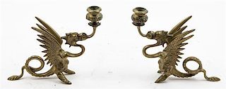 A Pair of Brass Griffin Form Candlesticks. Height 7 inches.