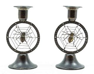 A Pair of German Cast Metal Candlesticks Height 6 1/2 inches.