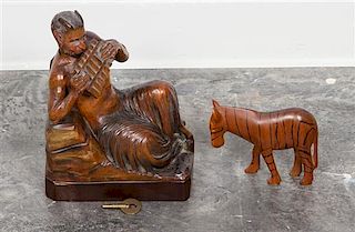 * A Carved Wood Figural Music Box Height of music box 9 3/4 inches.