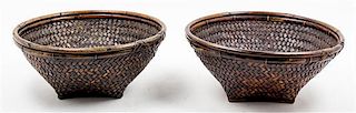 A Collection of Nine Woven Baskets Width of largest 19 inches.