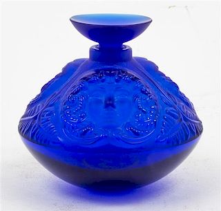 * A Lalique Molded and Frosted Glass Psyche Perfume Bottle Height 3 1/2 inches.