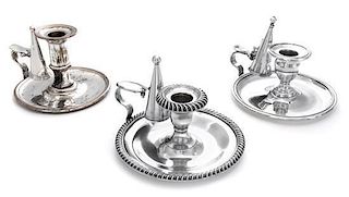 * Three Silver-Plate Chambersticks. Diameter of largest 5 1/2 inches.