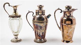 A Collection of Three Silver-Plate Serving Articles Height of tallest 9 3/4 inches.