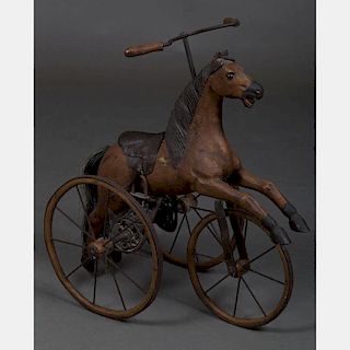 A Contemporary Carved Hardwood and Metal Child's Horse Form Tricycle, 20th Century.
