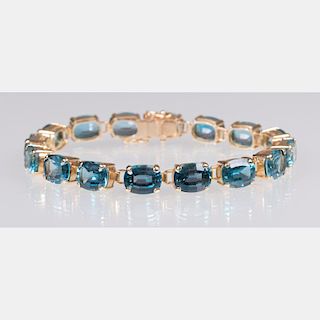 A 14kt. Yellow Gold and Blue Topaz Link Bracelet,