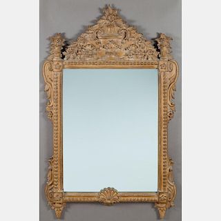 A Louis XV Style Carved Hardwood Mirror, 20th Century.
